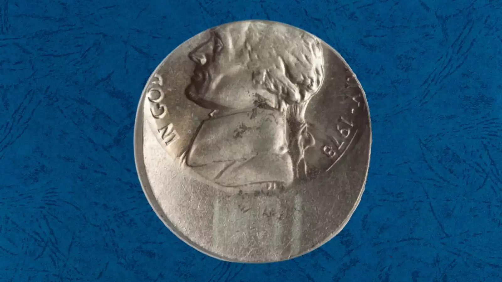 1978 Jefferson Nickel off-center strike error showing design shifted from center with blank planchet crescent