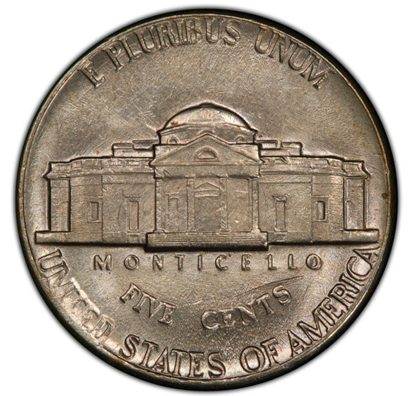 1978 Jefferson Nickel die cud error showing raised blob of metal merging with the coin rim where die fractured